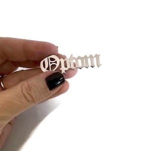 Optom optometry lapel pin