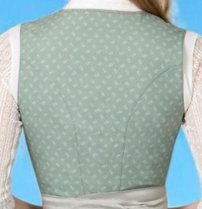 May include: Back view of a light green vest with a subtle floral pattern. The vest has white straps and a light grey waistband. The vest is worn over a white lace shirt.