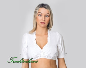 Peut inclure: Top de dirndl traditionnel blanc à manches courtes et col à volants.