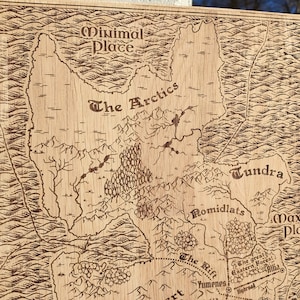 May include: A laser-engraved wooden map features various geographical locations, including Minimal Place, The Arctics, Tundra, Romidlats, and Maximal Place.  The map's style is reminiscent of vintage cartography, with detailed coastlines, rivers, and mountain ranges.  Names of locations are clearly labeled in a stylized font. The Rift and the Great Eastern Forest are also indicated. The wood's light brown color contrasts nicely with the darker brown engraved lines. The overall aesthetic is rustic and fantasy-themed, suitable for tabletop gaming or home decor.