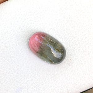 Natural bio tourmaline cabochon semiprecious gemstone in oval shape from africa