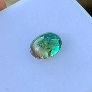 Natural bio tourmaline cabochon semiprecious gemstone in oval shape from africa.