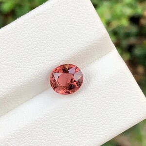 Natural orange tourmaline semiprecious gemstone in oval shape from africa