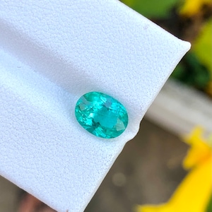 Natural apatite ( same looks like Colombian emerald ) semiprecious gemstone in oval shape from africa