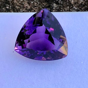 Natural amethyst semiprecious gemstone in triangle shape from africa