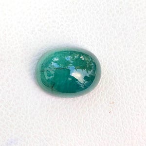 Natural indicolite tourmaline ( blue tourmaline) cabochon semiprecious gemstone in oval shape from africa