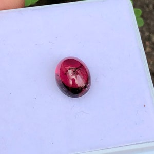 Natural rubilite tourmaline cabochon in oval shape semiprecious gemstone from nigeria