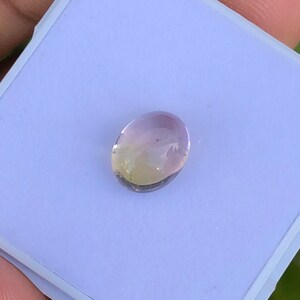 Natural bio tourmaline cabochon semiprecious gemstone in oval shape from africa