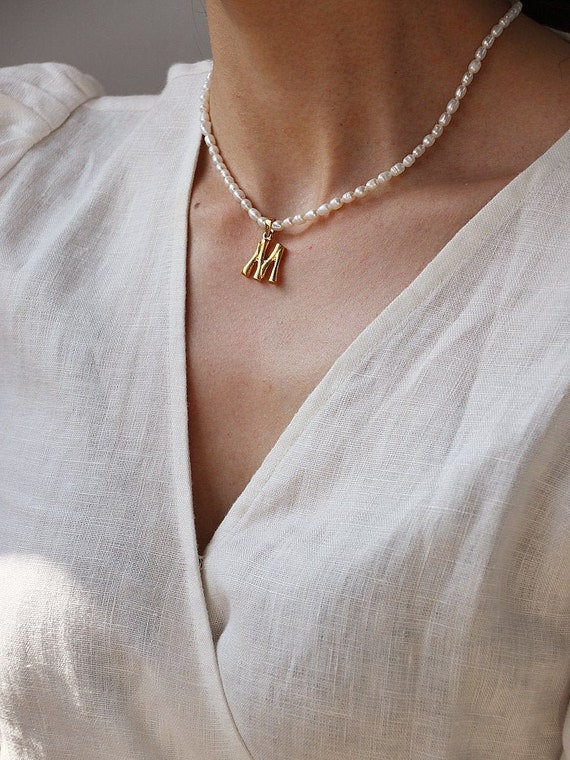 Pearl choker with initial deals
