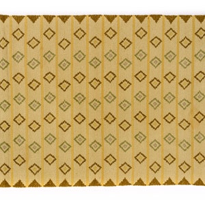 May include: A beige rug with a geometric pattern of brown, yellow, and green diamonds. The rug has a fringe border.