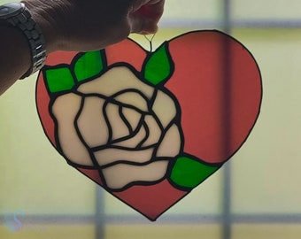 Stained glass rose in a heart