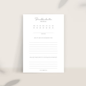 Könnte beinhalten: Ein druckbares Dankbarkeitsjournal mit weißem Hintergrund und schwarzem Text. Das Journal enthält einen Abschnitt für den Wochentag, das Datum, wofür du dankbar bist und was dich an diesem Tag glücklich gemacht hat.
