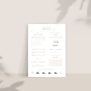 May include: A printable baby shower or birth announcement checklist with a light beige background and gold stars. The checklist includes sections for the baby's name, birthday, hair and eye color, weight, length, and first words. The text "Hallo kleines Wunder" is at the top of the page.