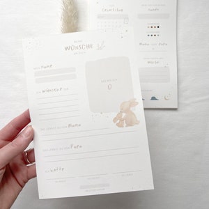 May include: A printable baby shower or new baby gift card with a cute illustration of two bunnies. The card has spaces to write the baby's name, the date of birth, and other wishes for the baby.