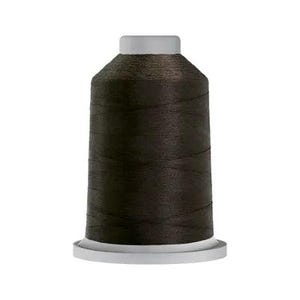 May include: A spool of dark brown thread with a white base and top. The thread is tightly wound, creating a cylindrical shape. Ideal for sewing and embroidery projects.