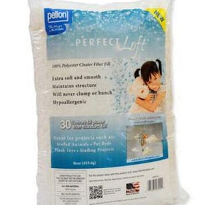 May include: A white bag of "Perfect Loft" polyester fiber fill. The bag has a blue and white label with text and an image of a child holding a stuffed animal. The bag is labeled "NEW" in yellow.
