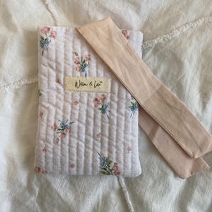 Kindle sleeve, e-reader cover, padded Kindle case, ribbon tie Kindle sleeve, handmade Kindle cover, elegant Kindle sleeve, fabric e-reader case, custom Kindle sleeve, gift for book lovers, travel Kindle pouch