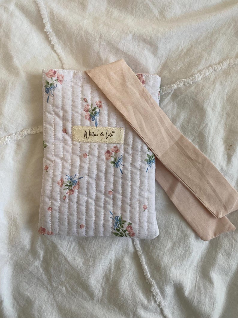 Kindle sleeve, e-reader cover, padded Kindle case, ribbon tie Kindle sleeve, handmade Kindle cover, elegant Kindle sleeve, fabric e-reader case, custom Kindle sleeve, gift for book lovers, travel Kindle pouch