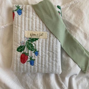 Kindle sleeve, e-reader cover, padded Kindle case, ribbon tie Kindle sleeve, handmade Kindle cover, elegant Kindle sleeve, fabric e-reader case, custom Kindle sleeve, gift for book lovers, travel Kindle pouch