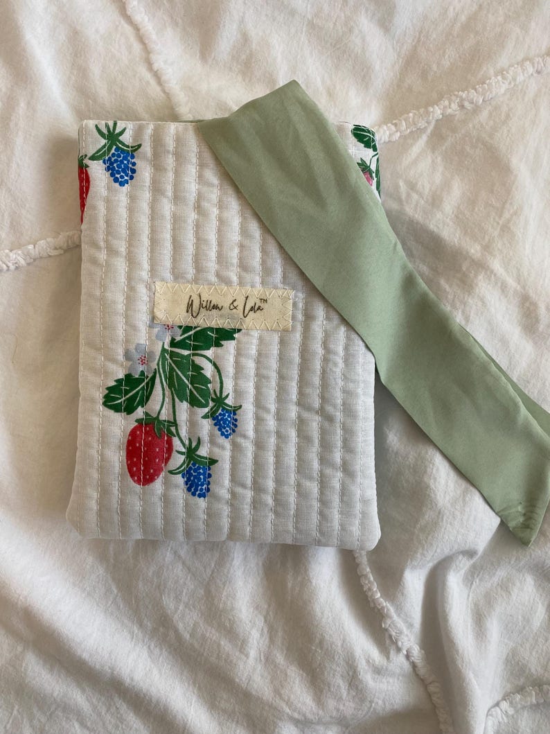 Kindle sleeve, e-reader cover, padded Kindle case, ribbon tie Kindle sleeve, handmade Kindle cover, elegant Kindle sleeve, fabric e-reader case, custom Kindle sleeve, gift for book lovers, travel Kindle pouch
