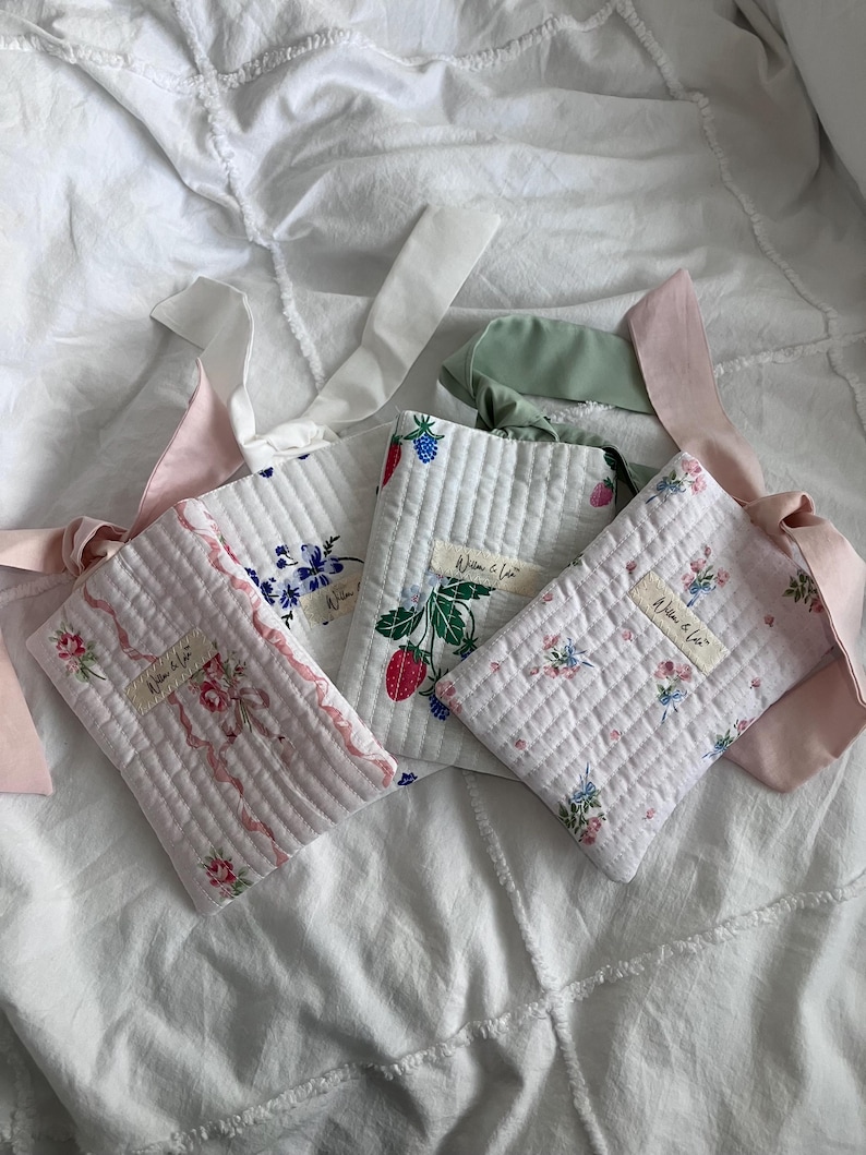 Kindle sleeve, e-reader cover, padded Kindle case, ribbon tie Kindle sleeve, handmade Kindle cover, elegant Kindle sleeve, fabric e-reader case, custom Kindle sleeve, gift for book lovers, travel Kindle pouch