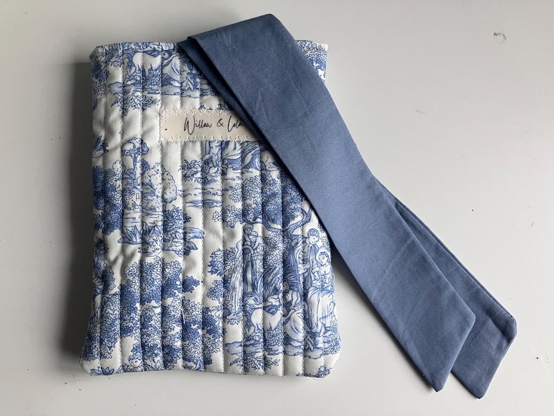 Kindle sleeve, e-reader cover, padded Kindle case, ribbon tie Kindle sleeve, handmade Kindle cover, elegant Kindle sleeve, fabric e-reader case, custom Kindle sleeve, gift for book lovers, travel Kindle pouch, gingham