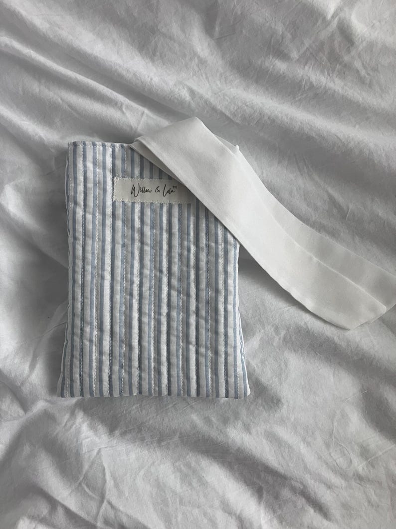 Kindle sleeve, e-reader cover, padded Kindle case, ribbon tie Kindle sleeve, handmade Kindle cover, elegant Kindle sleeve, fabric e-reader case, custom Kindle sleeve, gift for book lovers, travel Kindle pouch