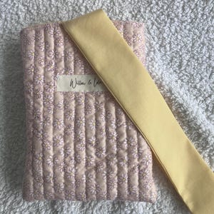 Kindle sleeve, e-reader cover, padded Kindle case, ribbon tie Kindle sleeve, handmade Kindle cover, elegant Kindle sleeve, fabric e-reader case, custom Kindle sleeve, gift for book lovers, travel Kindle pouch