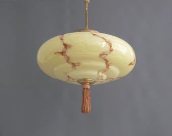 Art Deco pendant lamp with yellow glass shade and brass rod suspension - circa 1920-1930