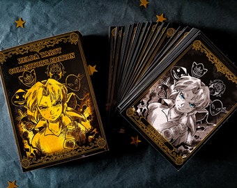 May include: A Zelda Tarot Collector's Edition deck featuring a black box with gold foil illustrations of a character and various masks. Beside the box, a fanned-out stack of cards displays a black and white character illustration with the text CONNECT.