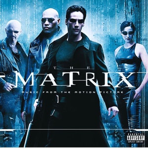 May include: The Matrix movie soundtrack album cover featuring four characters in a blue and black digital background. The title "The Matrix" is in white text with the words "Music from the Motion Picture" below it.