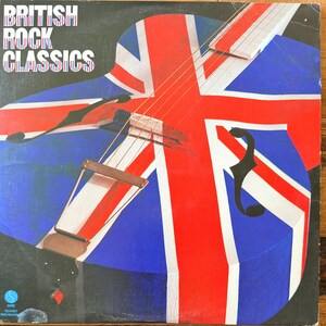 May include: Album cover for "British Rock Classics" featuring a guitar design overlaid with the Union Jack flag. The album art has a blue background with red and white stripes, and the title is in white block letters.