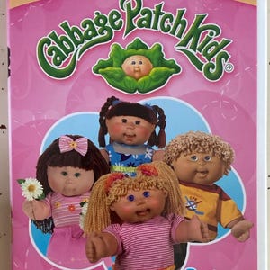 May include: Cabbage Patch Kids Collectors Set DVD featuring five episodes of fun and memories. The cover has a pink background with the Cabbage Patch Kids logo and images of the dolls.
