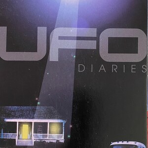 May include: A VHS tape cover with the title "UFO Diaries." The image features a glowing UFO above a house and a vintage car. Text includes "The First UFOs," "Message From Space," and "True or False?"