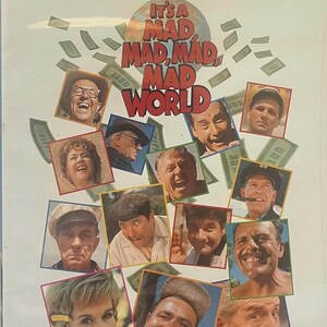 May include: DVD case for the film "It's a Mad, Mad, Mad, Mad World." The cover features a collage of character portraits and the film's title in large, bold letters. The MGM logo is at the top.