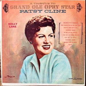 May include: A vintage vinyl record cover titled A Tribute to Grand Ole Opry Star Patsy Cline, featuring a painted portrait of Patsy Cline in a light blue shirt against a peach background, with track listings and the Crown Records logo visible.