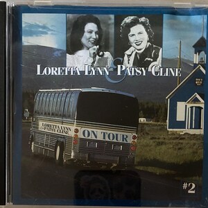 May include: CD case featuring Loretta Lynn & Patsy Cline. The cover includes portraits of the singers, a tour bus, and a blue church. The text reads "Loretta Lynn & Patsy Cline" and "On Tour."