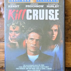 May include: A DVD case for the film Kill Cruise, featuring the title in red and white text, and portraits of actors Patsy Kensit, Jurgen Prochnow, and Elizabeth Hurley. The cover includes the Front Row Features logo and a small sailboat graphic.