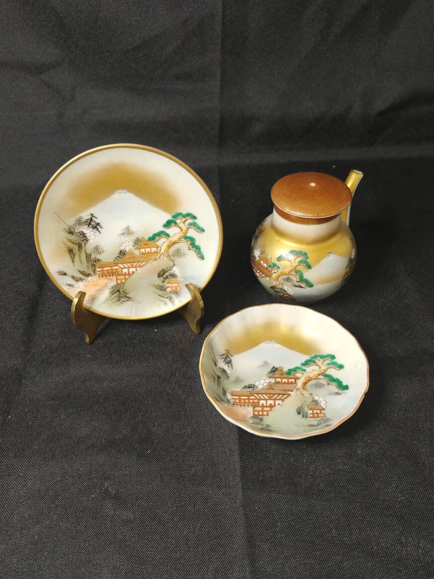 Small plate, bowl and matching teapot hand painted with Asian Pagodas and Mountains
