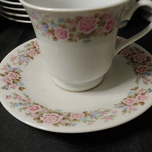 Footed Teacup and Saucers in Pink Roses and Blue Posies, made in China Jingdezhen (Set of 5 with one extra saucer)