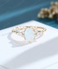 Oval Opal engagement ring 14K gold engagement ring vintage engagement ring marquise cut diamond unique twisted ring anniversary promise ring