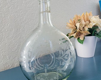 Decorative Clear Glass Cologne Bottle With Etched Design.