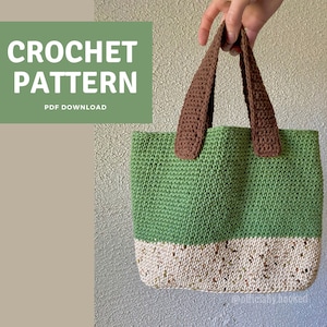 May include: Crochet pattern PDF download for a green and white tote bag with brown handles. The bag is made with a simple stitch and has a contrasting bottom section.