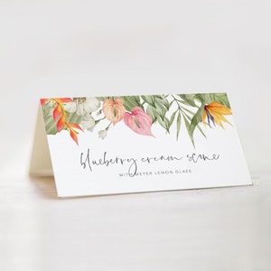 Puede incluir: Una tarjeta blanca con un borde floral de acuarela con flores naranjas, rosas y verdes. El texto en la tarjeta dice "Blueberry cream scone with Meyer lemon glaze".