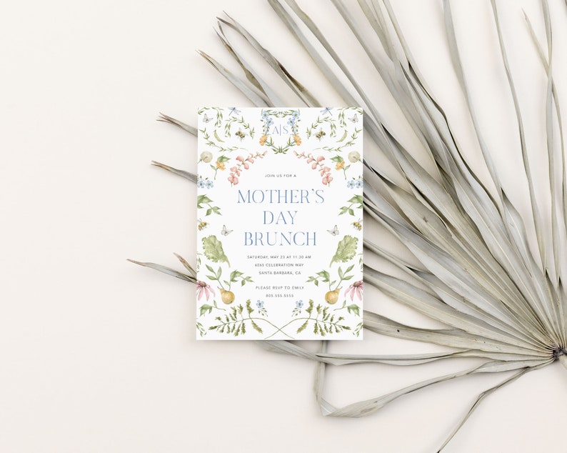 May include: A white invitation card with a floral design and the text "Join us for a Mother's Day Brunch" in blue lettering. The invitation includes the date, time, and location of the event.