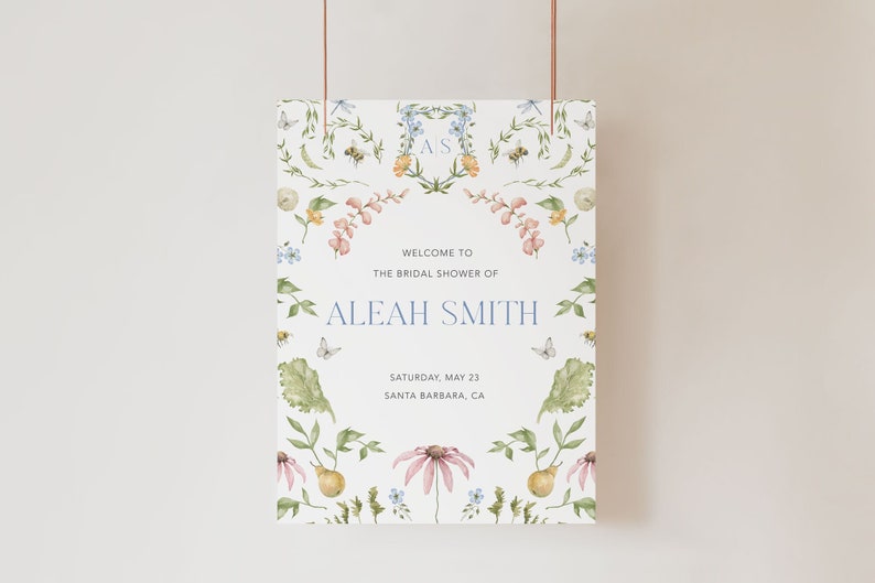 May include: A white bridal shower sign with a floral design featuring butterflies, bees, and leaves. The text reads "Welcome to the bridal shower of Aleah Smith, Saturday, May 23, Santa Barbara, CA".
