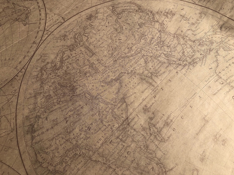 May include: An antique world map printed on aged paper with brown ink. The map shows the continents of North America, South America, Europe, Asia, and Africa. The map is surrounded by a decorative border.