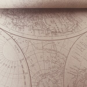 May include: A vintage world map printed on paper with a sepia tone. The map shows the continents of North America, South America, Europe, Asia, Africa, and Australia. The map is divided into sections by lines of longitude and latitude. The map is titled "South Pole" and "Arctic Ocean".