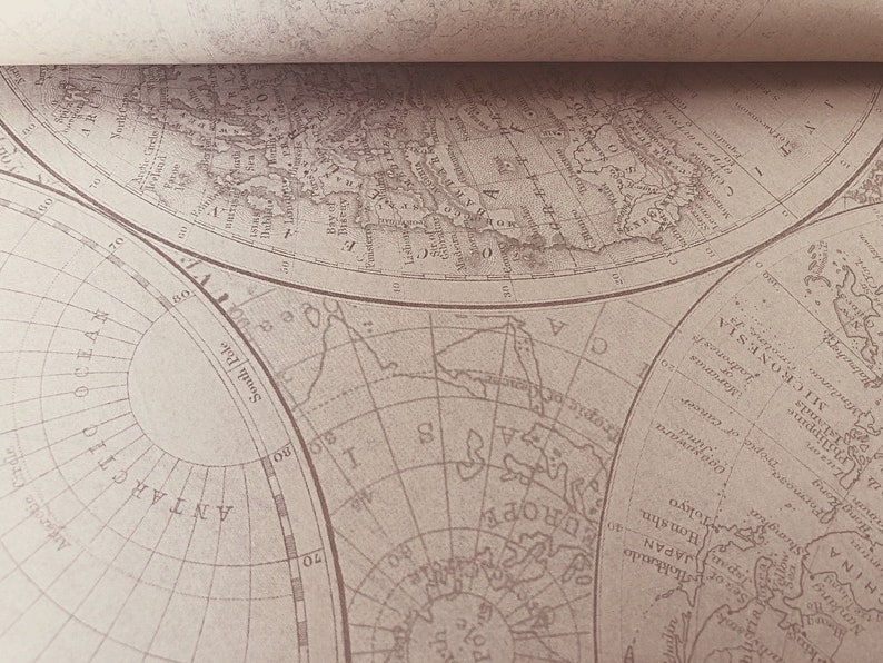 May include: A vintage world map printed on paper with a sepia tone. The map shows the continents of North America, South America, Europe, Asia, Africa, and Australia. The map is divided into sections by lines of longitude and latitude. The map is titled "South Pole" and "Arctic Ocean".