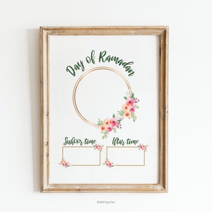 May include: Printable Ramadan calendar with a floral wreath and gold accents. The calendar has spaces to write in the times for Suhoor and Iftar.